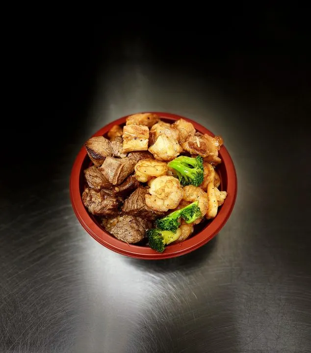 Hibachi chicken bowl served with rice and vegetables